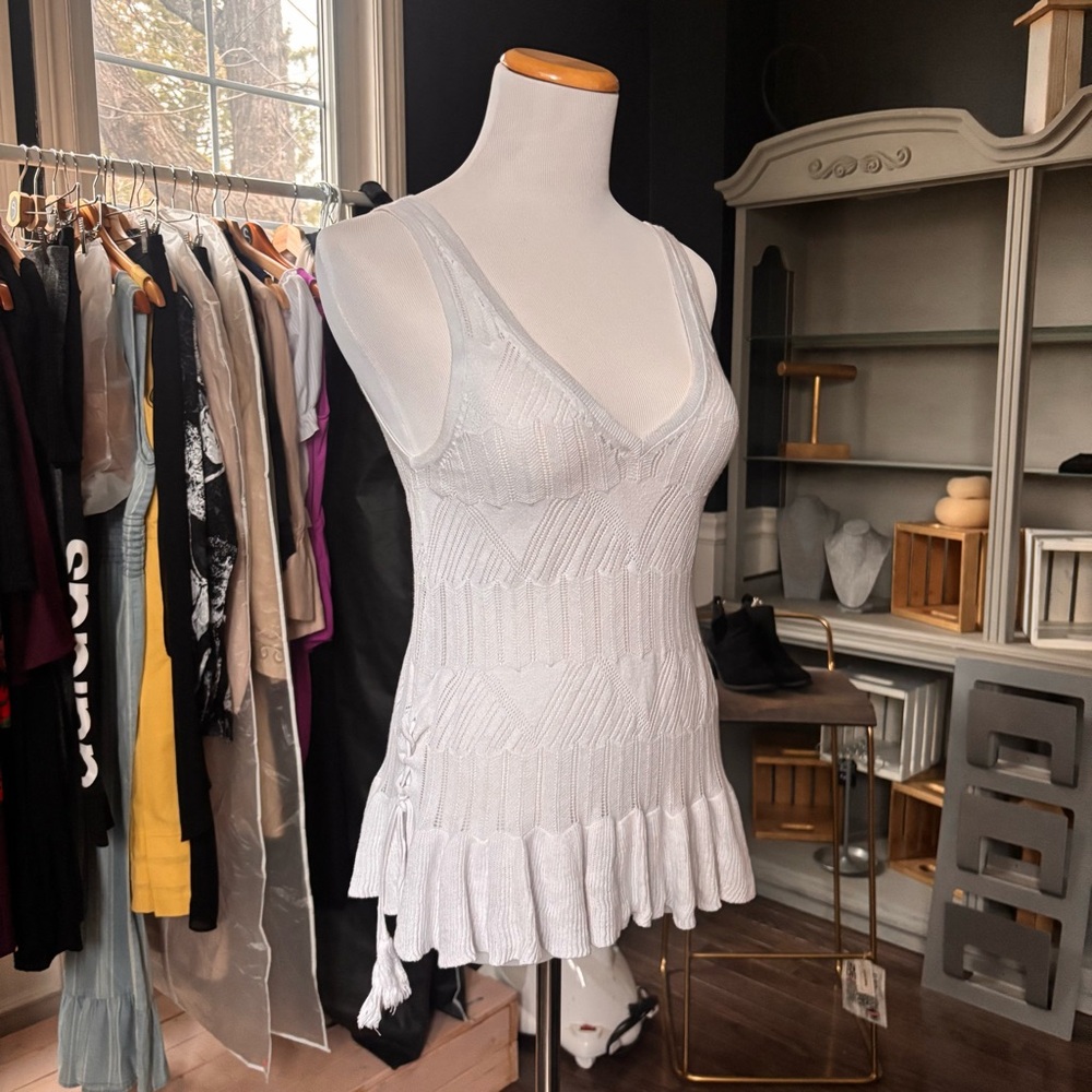 White Sleeveless Knit Top with Ruffle Hem